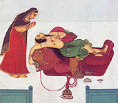 Shaivite doing sadhana- smoking charas in a bong